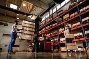 Warehouse workers organizing packages