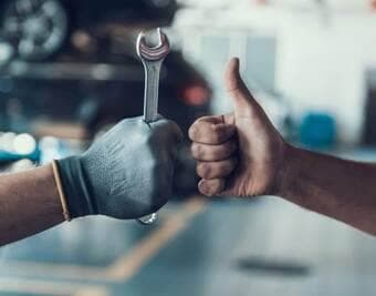 Service technician with wrench